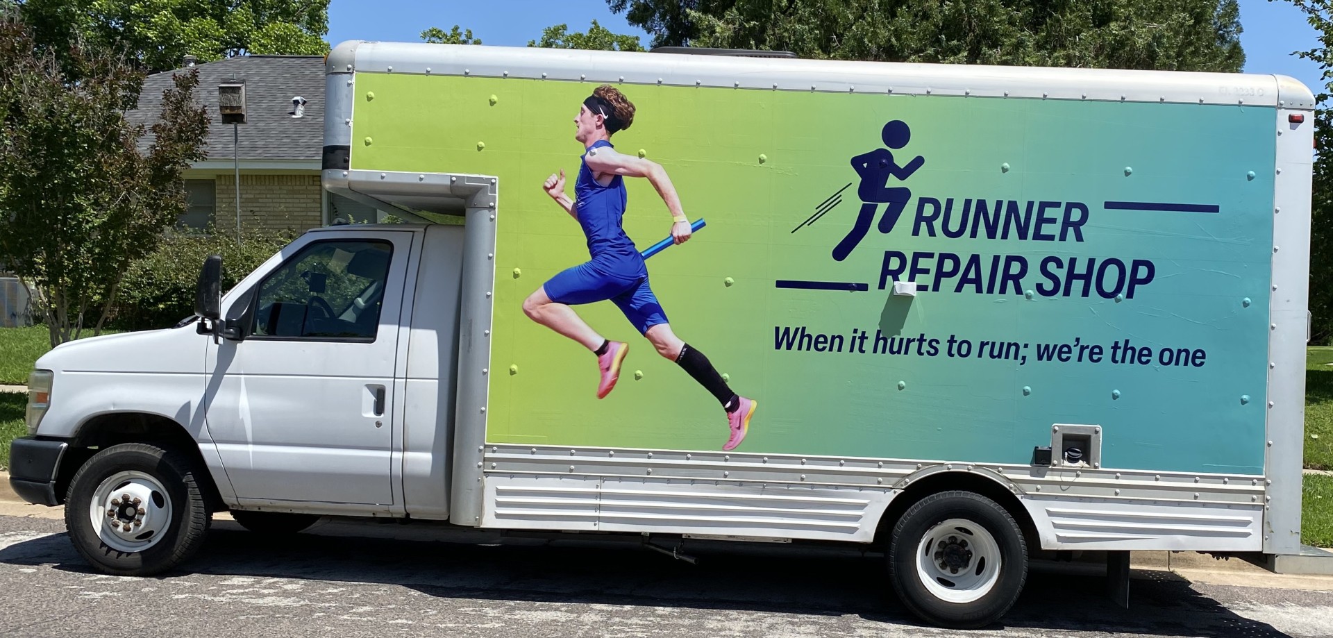 Runner Repair Shop mobile PT truck parked on a neighborhood street